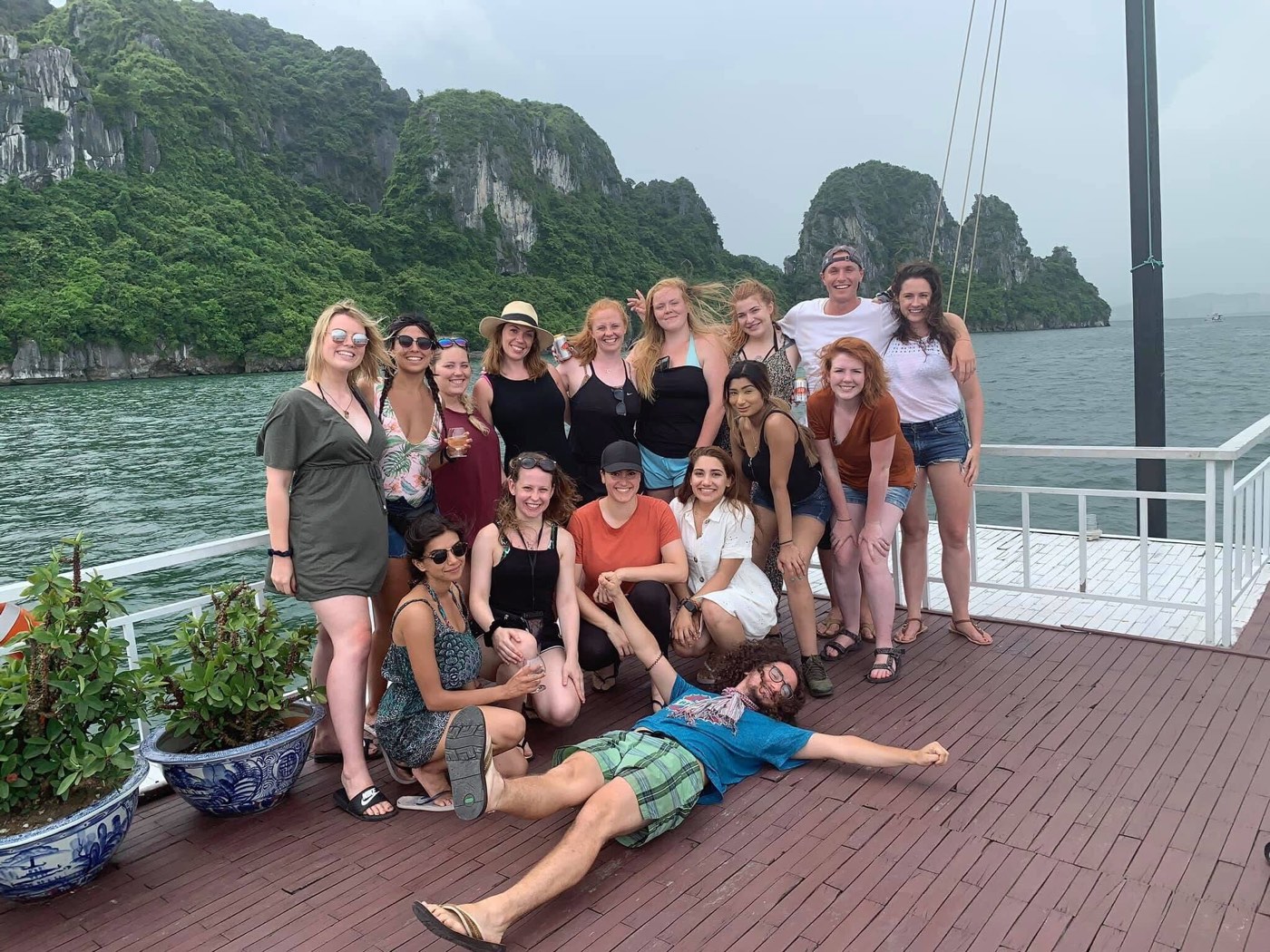 Group of travelers on a boat during the Southeast Asia backpacking tour