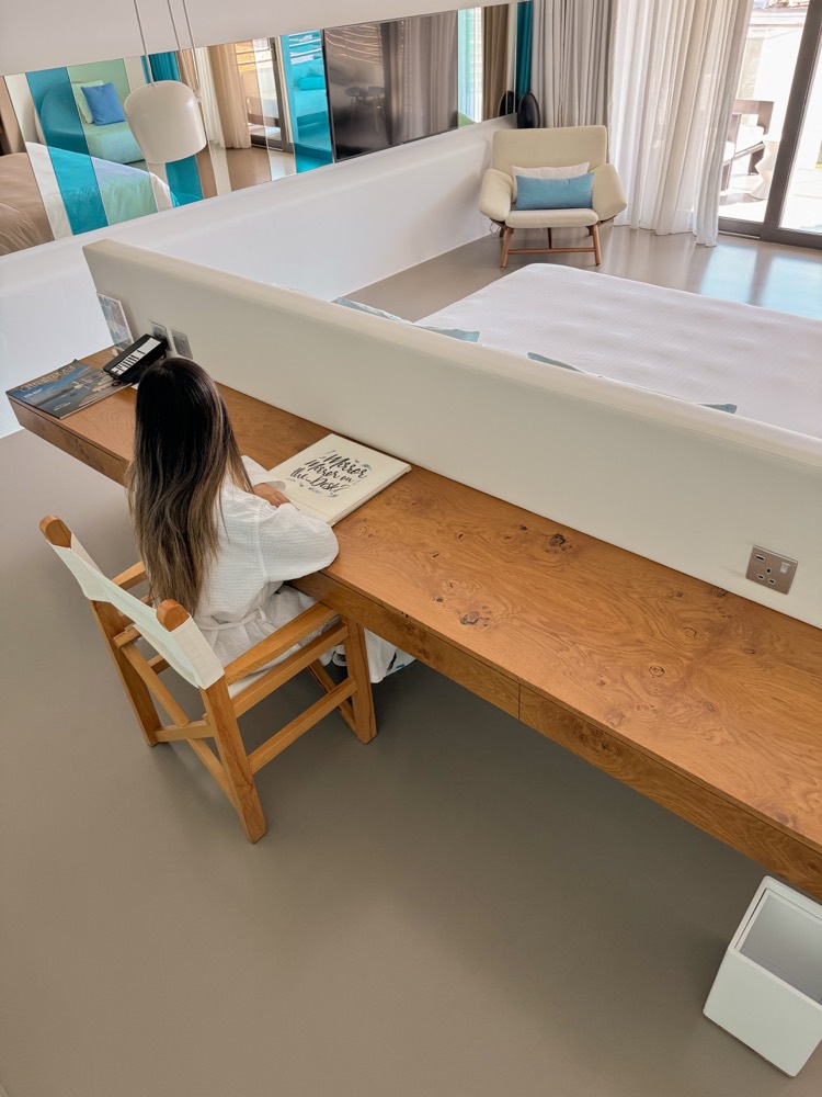 Guest planning travel from a resort room desk